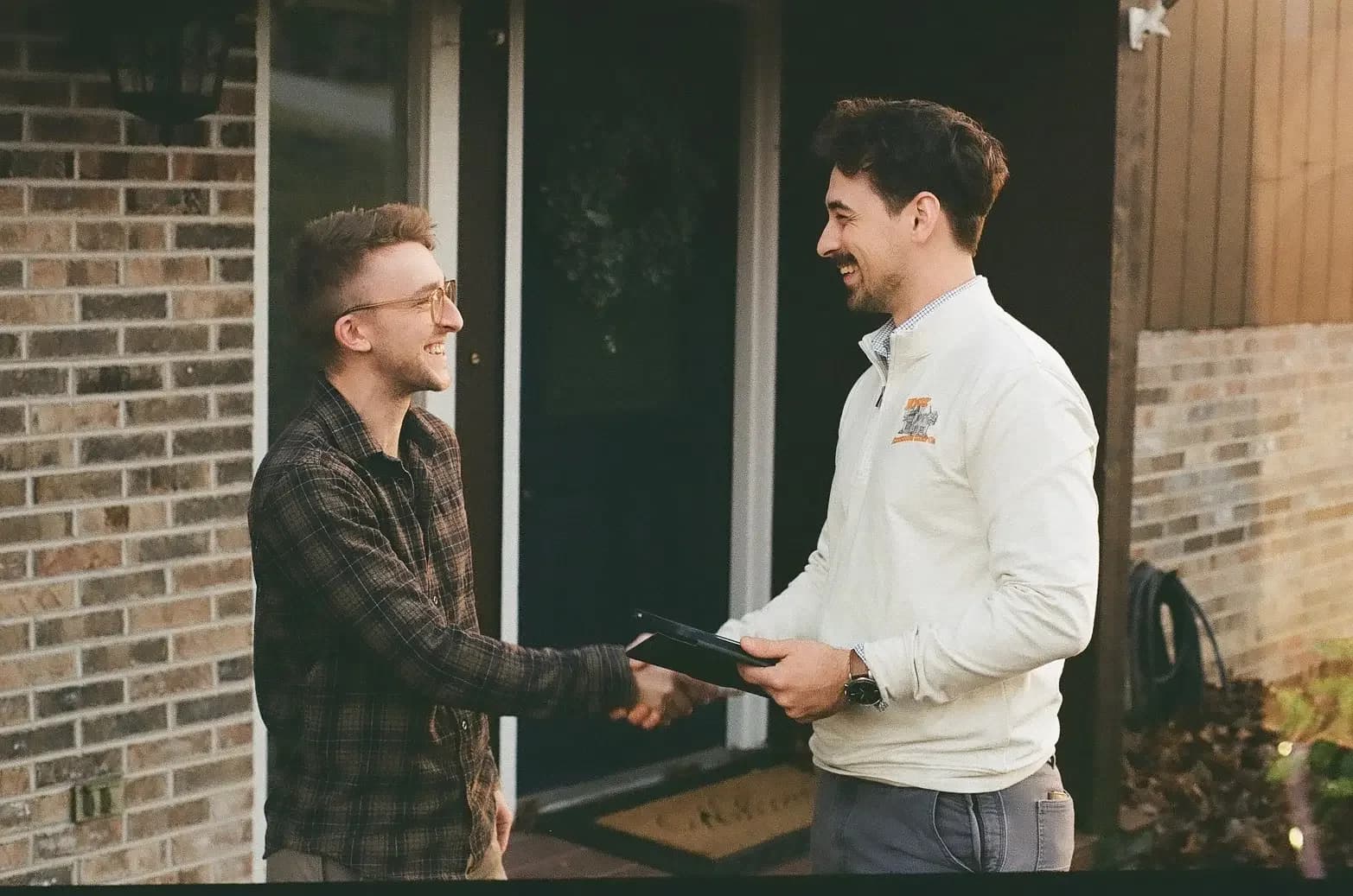 Knox Exterior Care Company founder Nicholas Dunn shaking hands with a commercial client